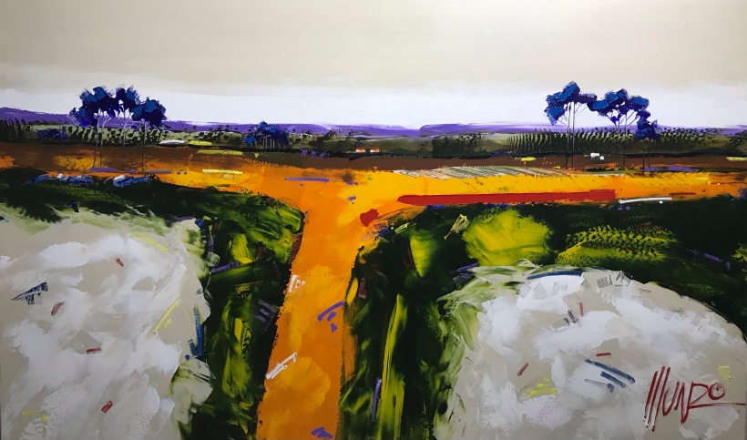 Very big landscape painting by famous South African artist Munro. exhibited at decorex 2022. Painted with builders' trowels. Blue trees, white and green fields, purple horizon line, orange yellow with beige sky. Outsized, extra large painting.